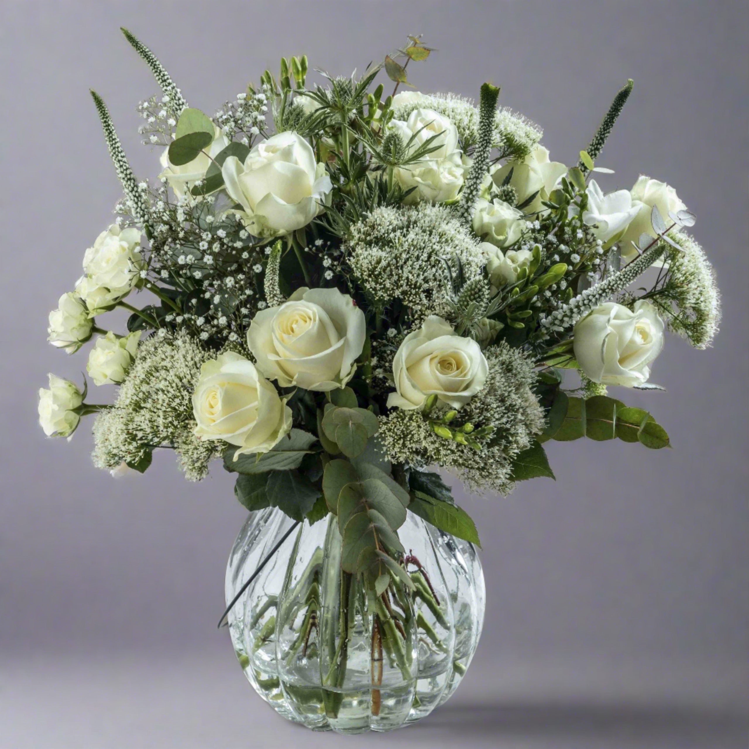 Sea spray flower bouquet in a glass vase