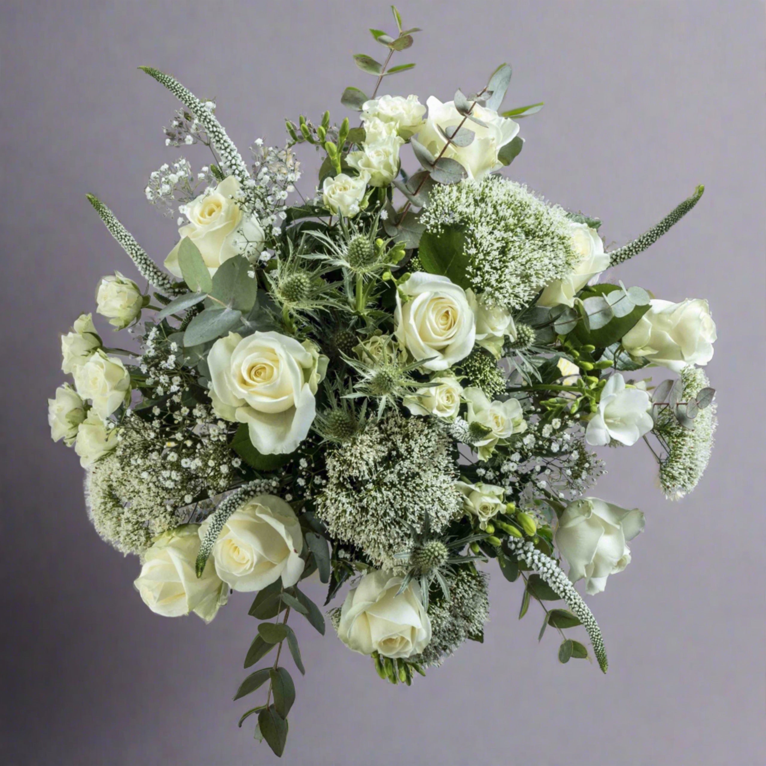 Top down view of Sea spray flower bouquet in a glass vase