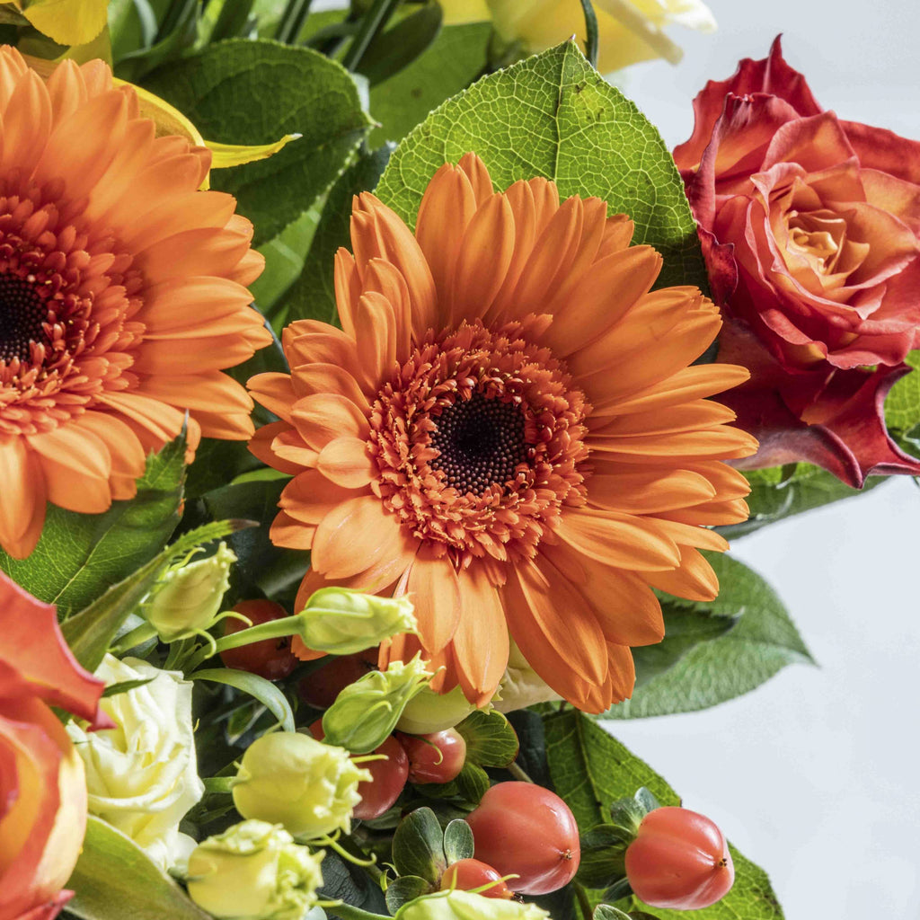 CLose up view of Hot Stuff flower bouquet in a glass vase