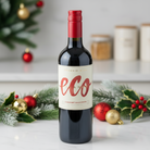 Bottle of eco wine with Christmas decorations in the background