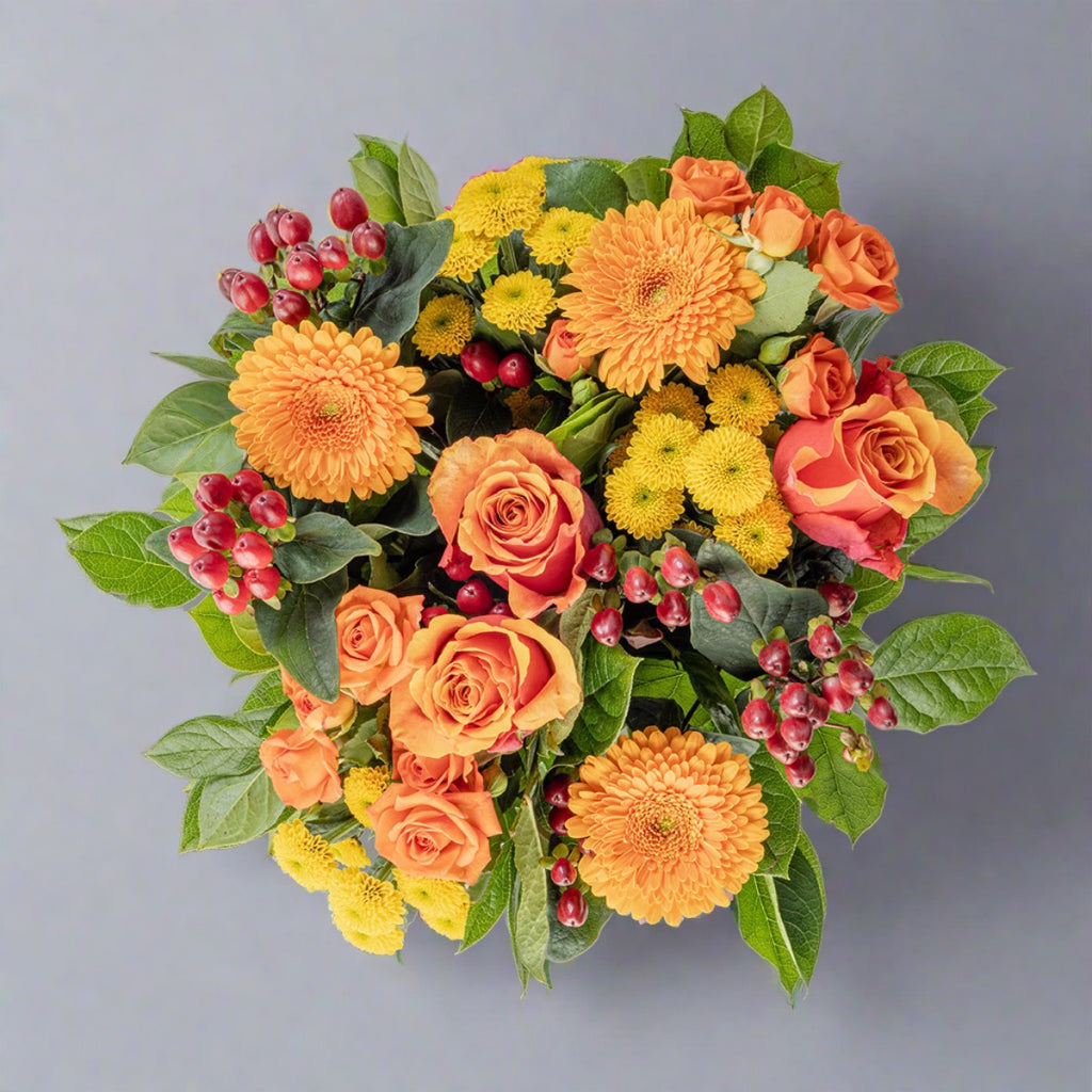 Top down view of Citrus bouquet and prosecco bottle