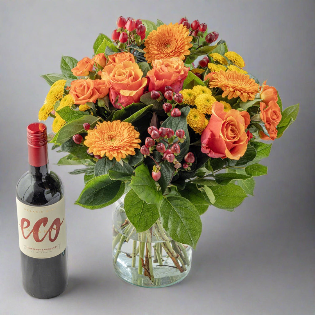 Citrus bouquet and red wine bottle