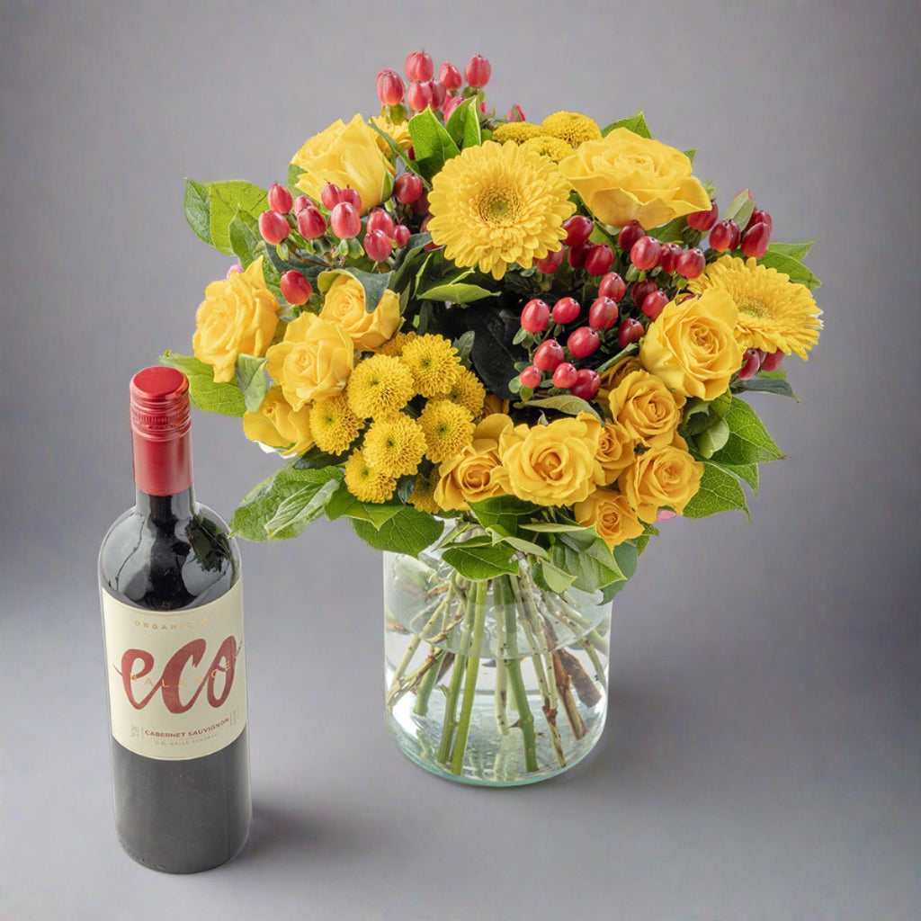 Lemon flowers bouquet with red wine bottle
