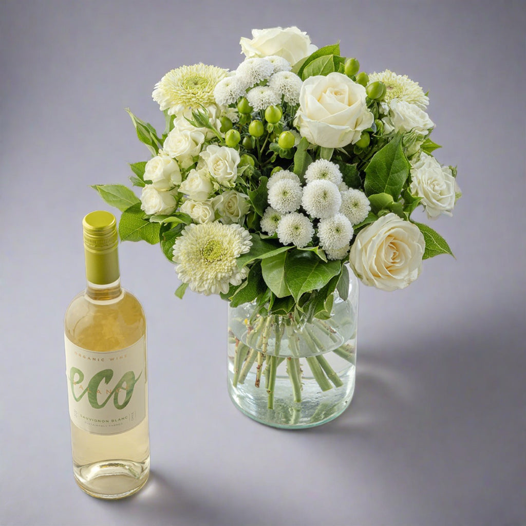 White flowers bouquet with bottle of Eco white wine