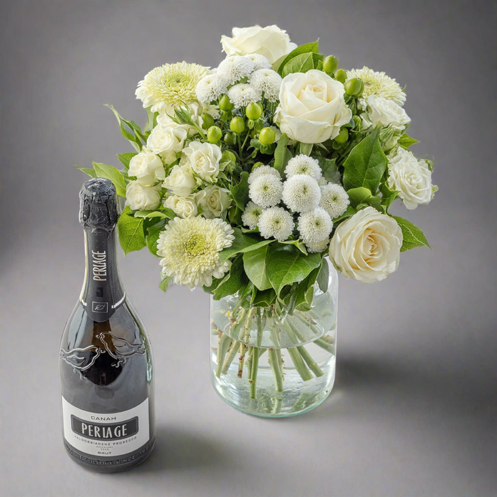 White flowers bouquet with bottle of periage prosecco