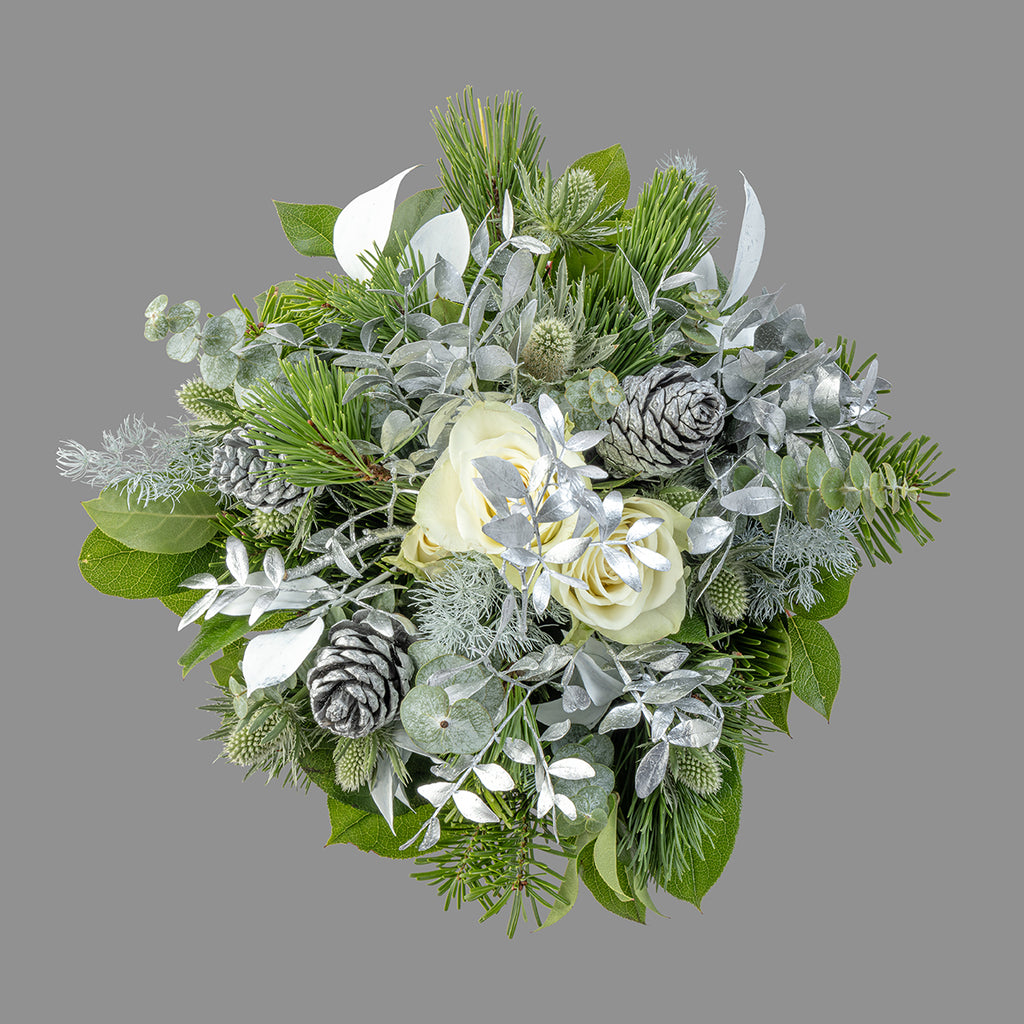 Top down view of white Christmas tabletop arrangement