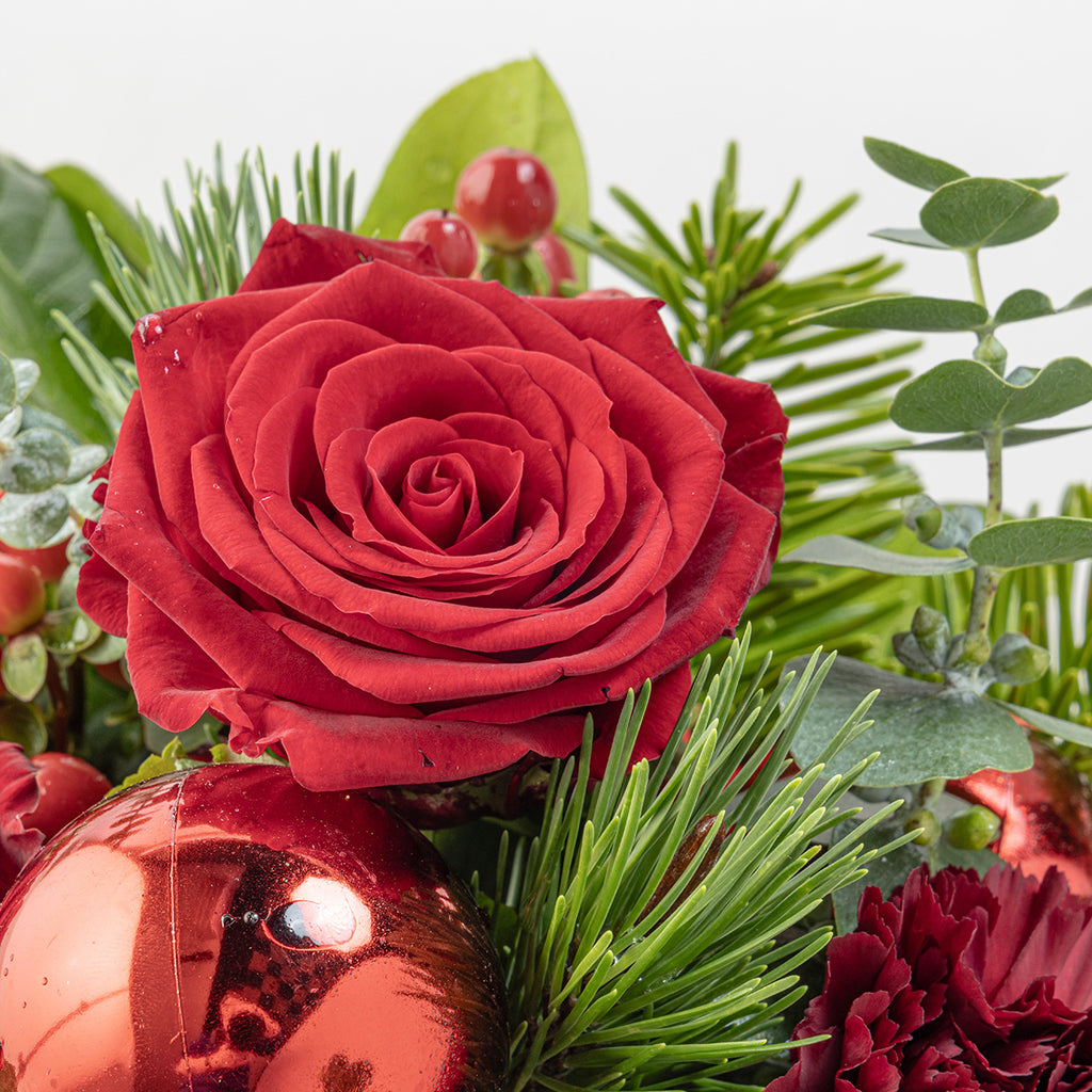 Close up view of Christmas reds tabletop bouquet
