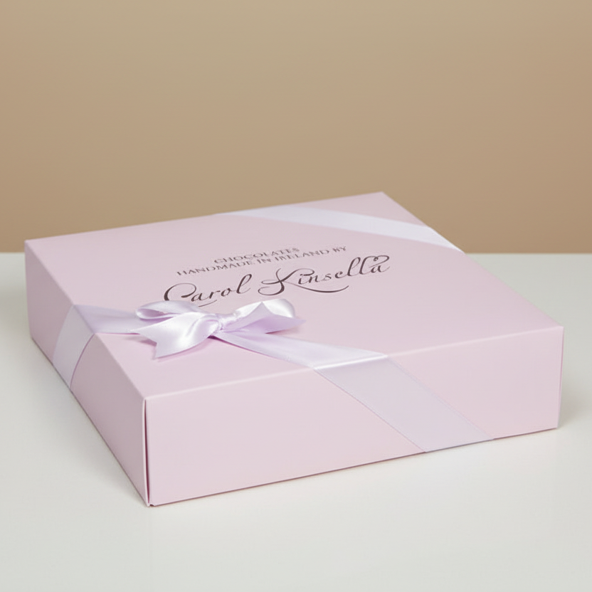 Pink gift box with a white ribbon on a beige background