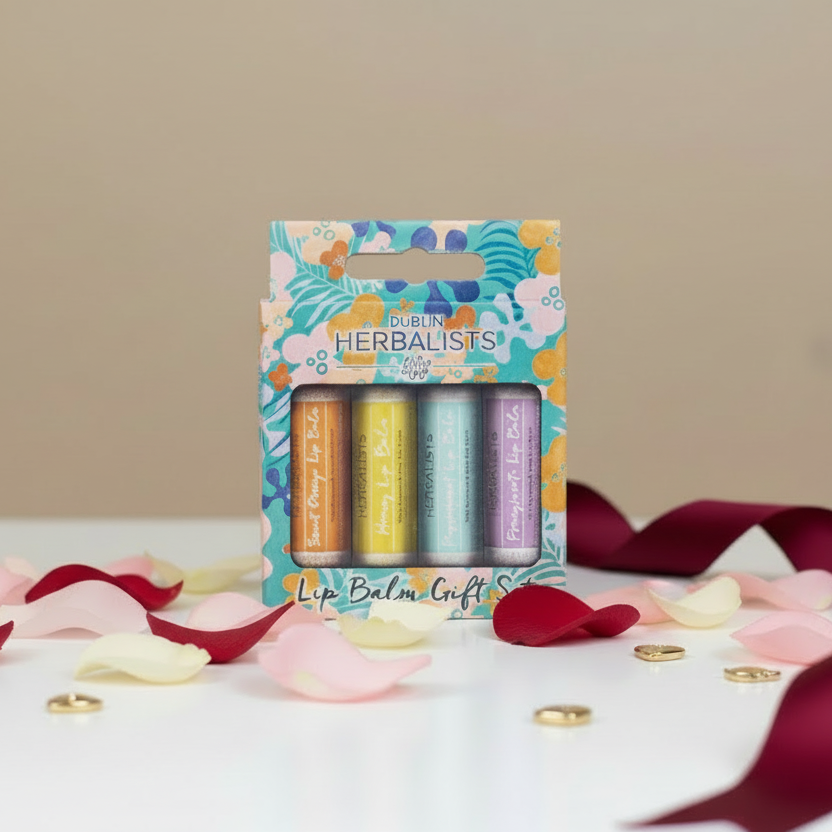 Packaged lip balm set with colorful design on a beige background