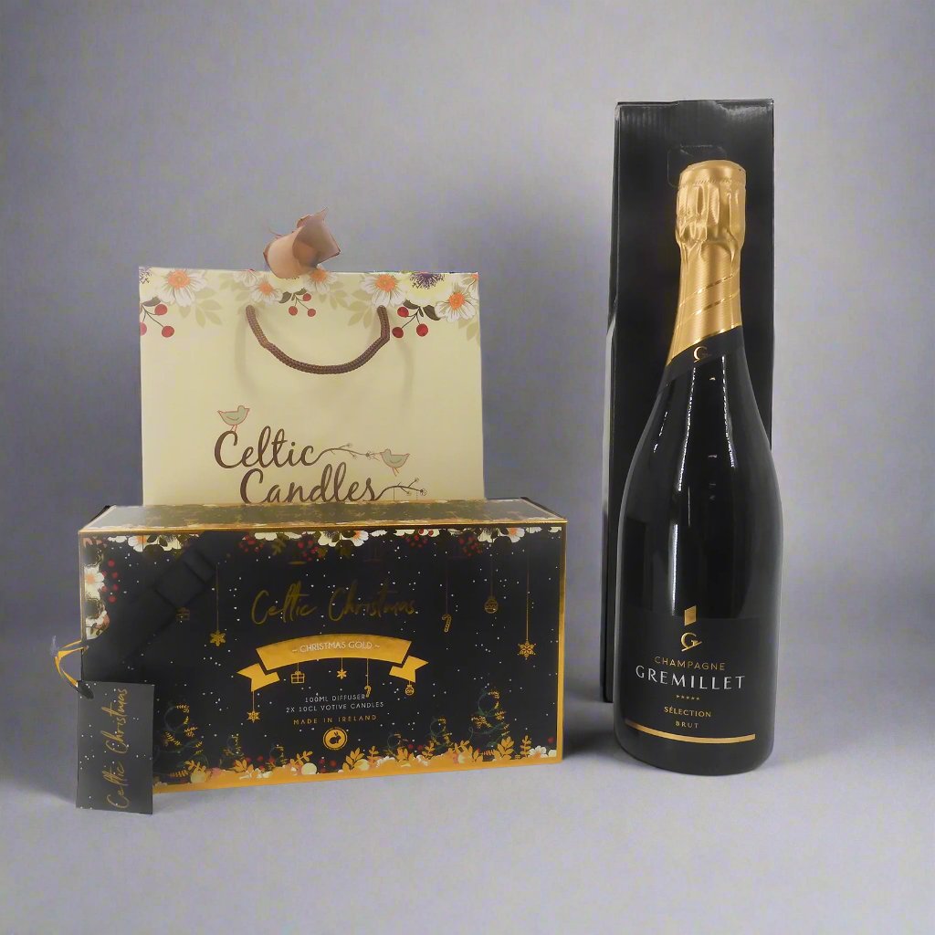 Christmas gift set with Gremillet champagne, a Celtic Christmas candle set, and a diffuser from lower angle