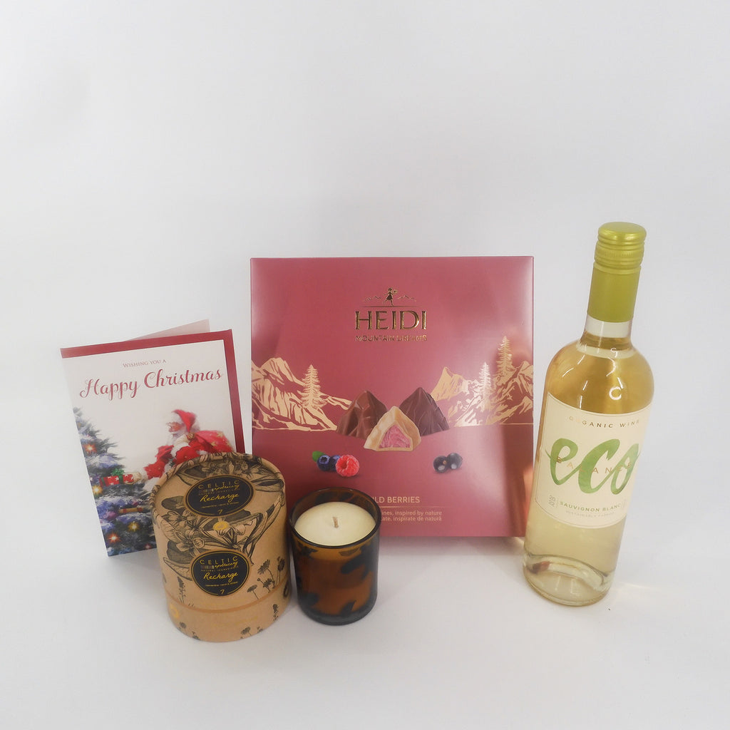 A luxurious Christmas gift set complete with a bottle of Eco white wine, Heidi Swiss Chocolate selection, a lovely scented candle and friendly Happy Christmas card