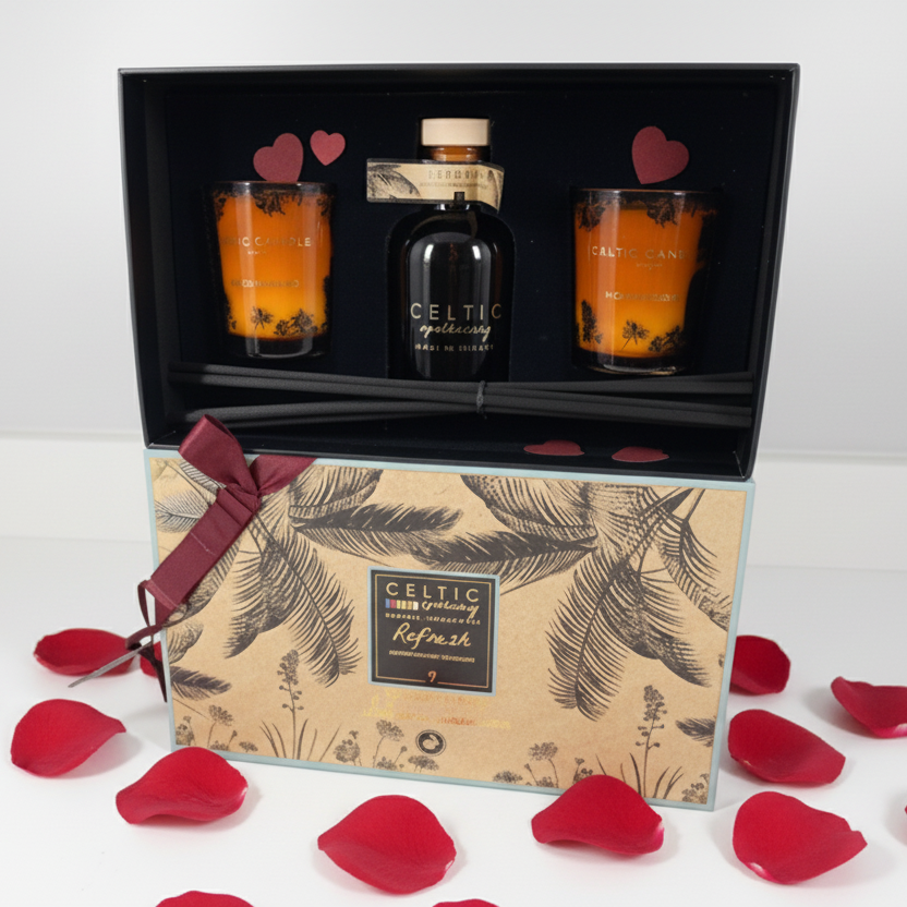 Gift set with a bottle and two glasses in a decorative box with leaf patterns.