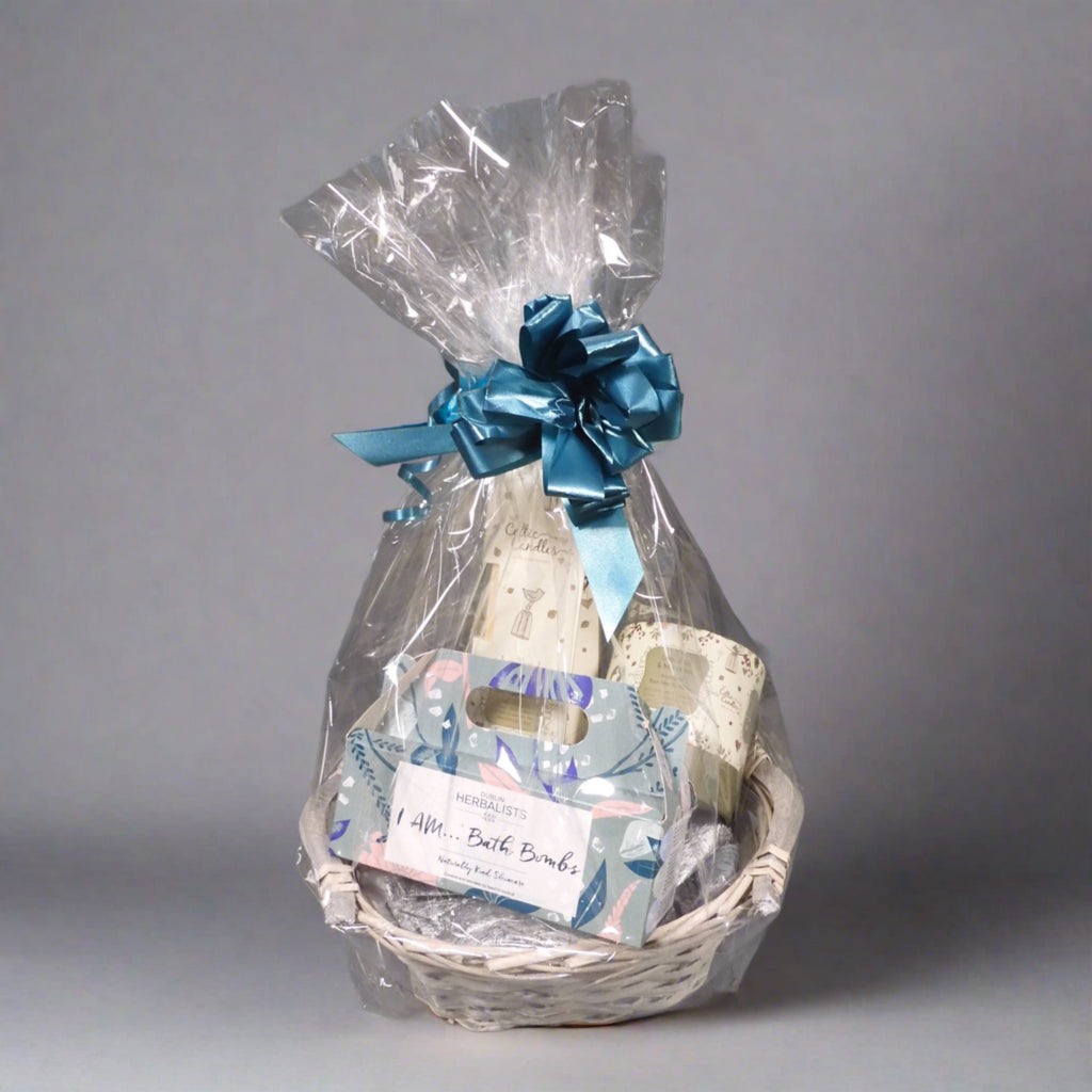beauty gift set with bath bombs, a diffuser and other gifts wrapped