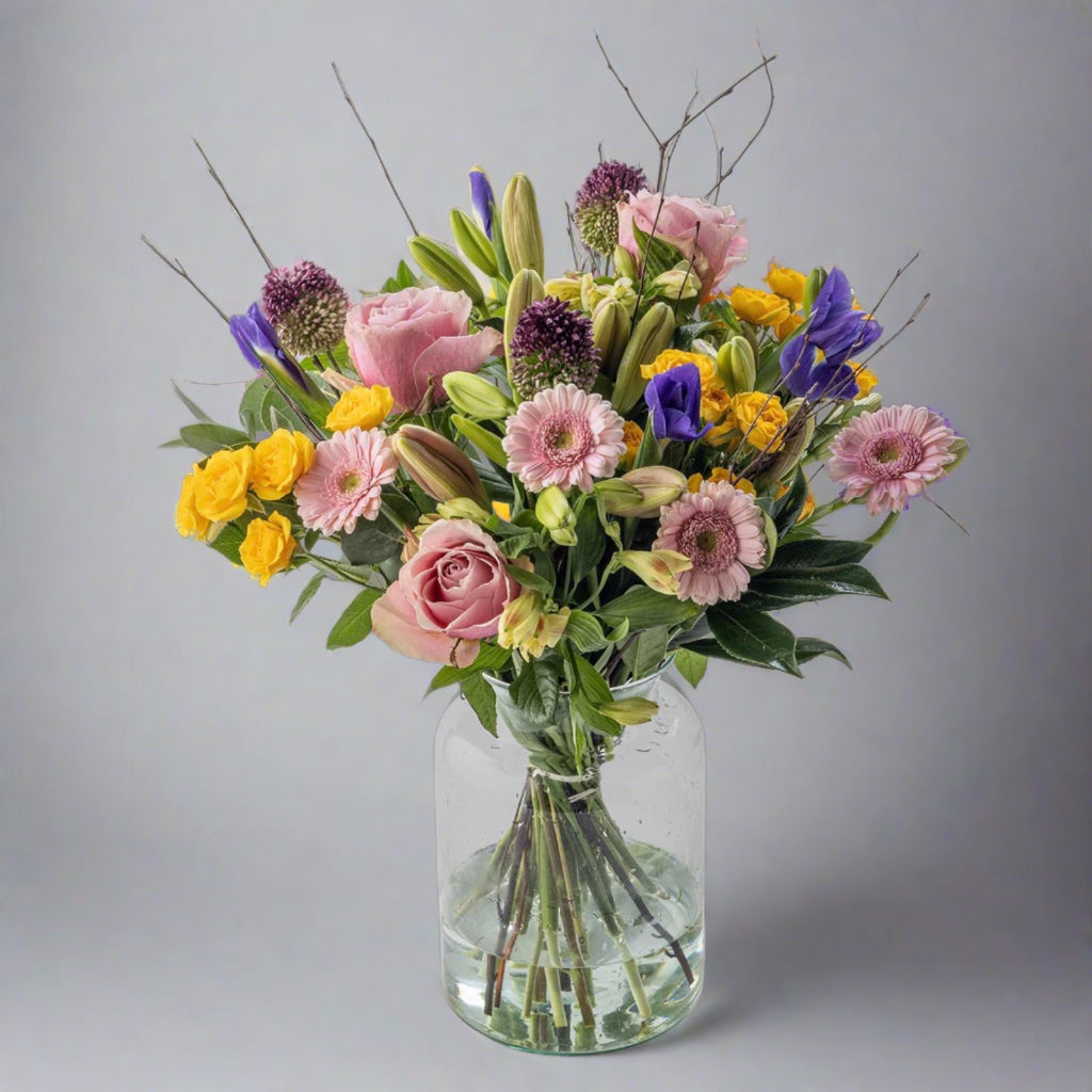 Mothers day spring flowers bouquet in a glass vase