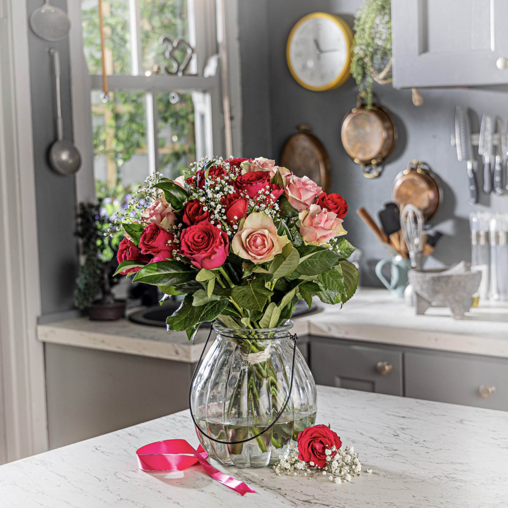 Lifestyle picture of mothers day roses bouquet in a glass vase