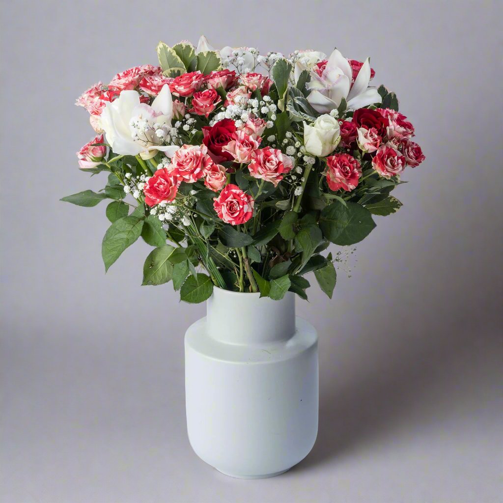 Christmas Sparkle flower bouquet with speckled red and white roses