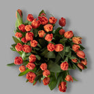 Top down view of Christmas orange tulips bouquet