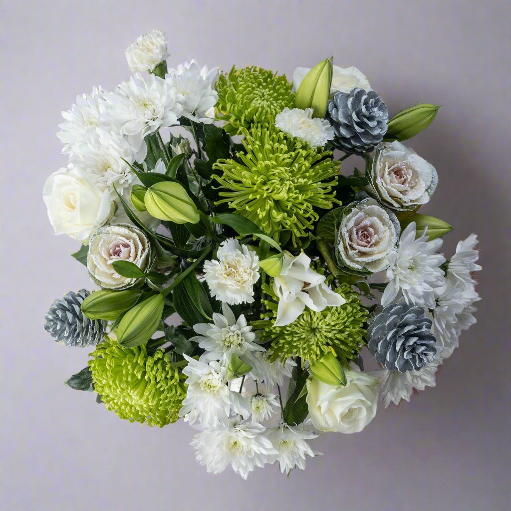 Top down view of Christmas Snowdrift bouquet with white roses