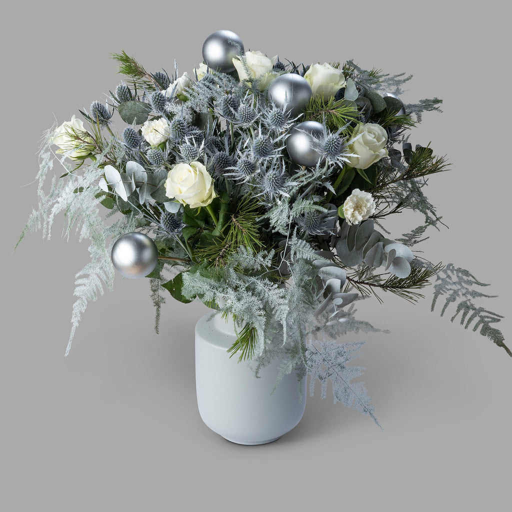 White roses christmas frosty flower bouquet with baubles