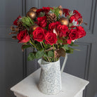 Lifestyle picture of Christmas velvet red roses bouquet