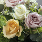 Close up view of Pastels flower bouquet in glass vase