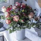 Lifestyle picture of Sweetness rose flower bouquet in a glass vase