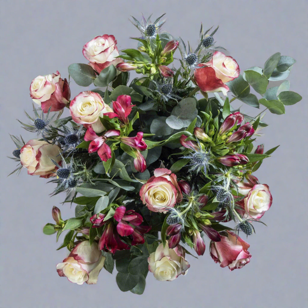 Top down view of Sweetness rose flower bouquet in a glass vase