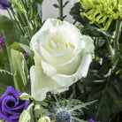 Close up of white rose from New Moon flower bouquet