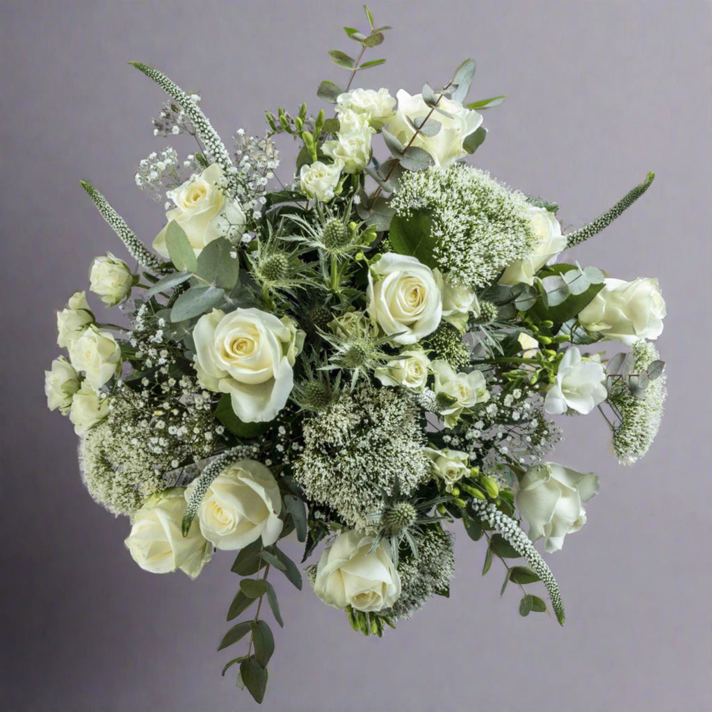 Top down view of Sea spray flower bouquet in a glass vase