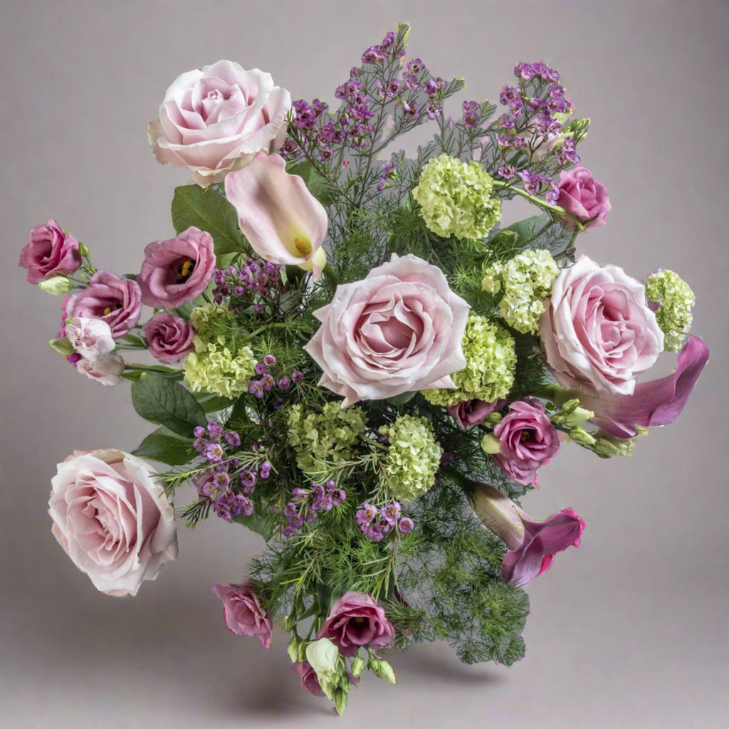 top down view of blush flower bouquet with pink roses