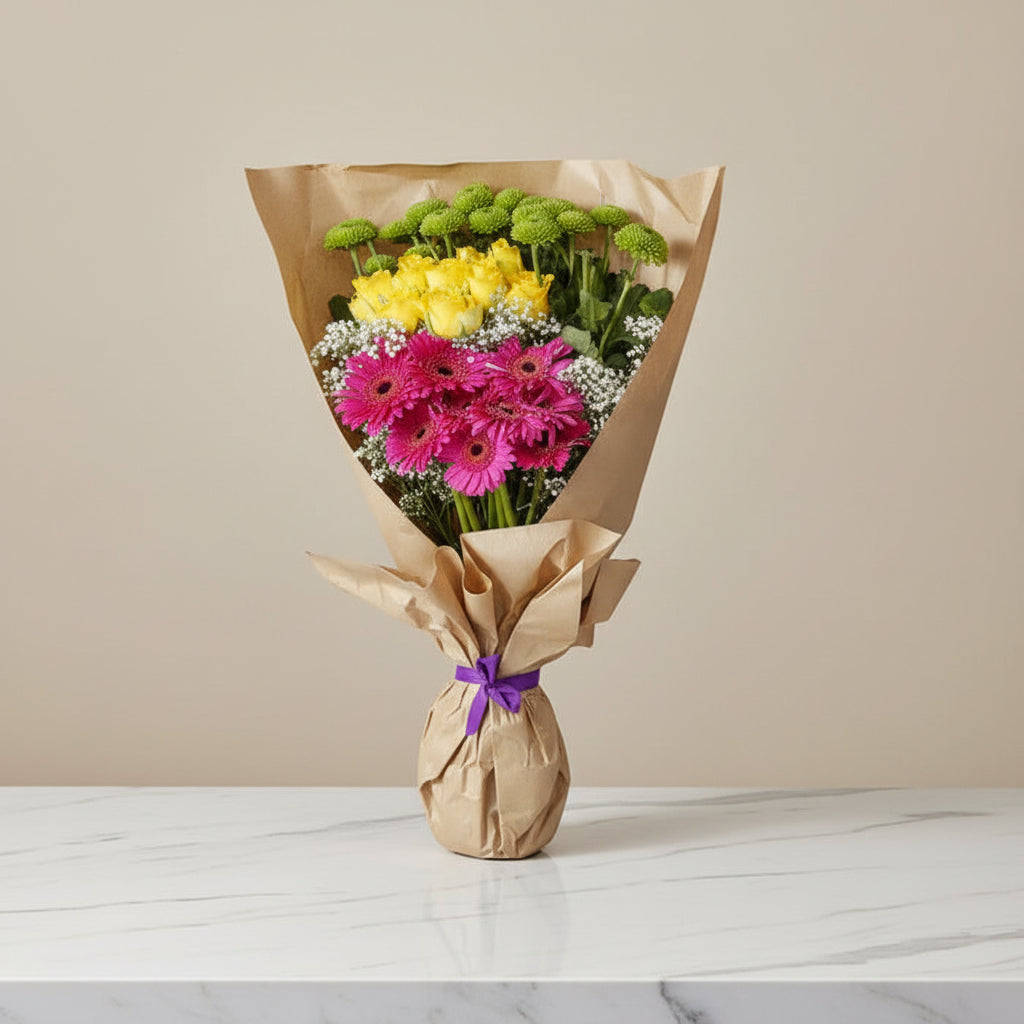 Assortment of flowers arranged in a brown paper bag