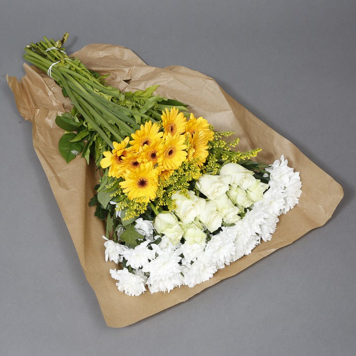 White and yellow flowers in paper wrapping