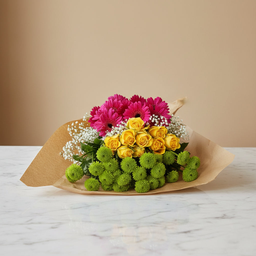 Green, yellow and pink flowers in paper wrapping