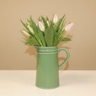 Mothers day tulips in green ceramic jug