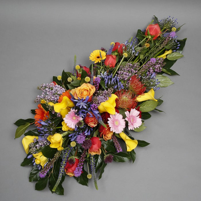 Mixed colour funeral spray