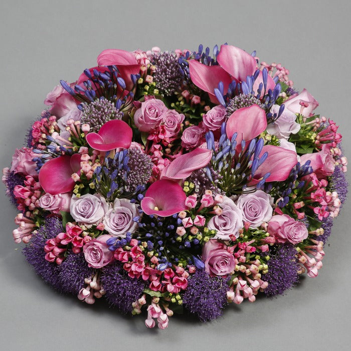 side view of pink funeral wreath