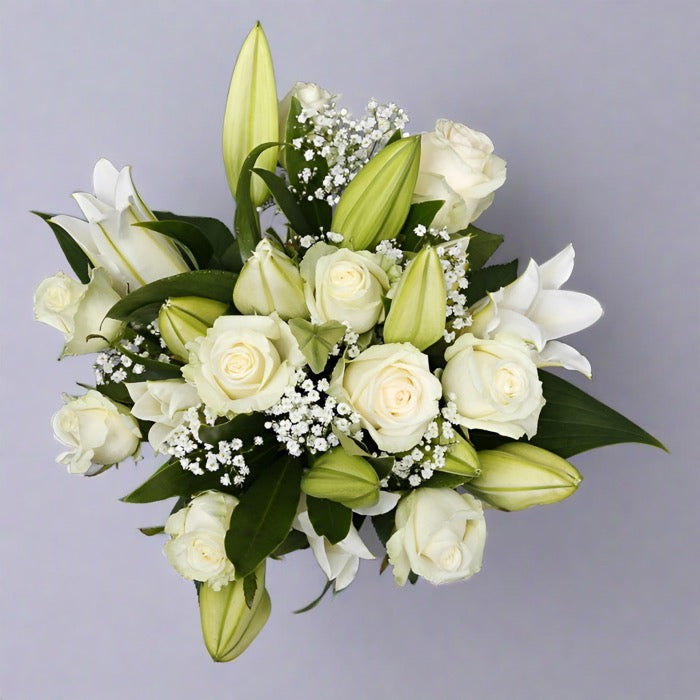 Top down view of Rose and white lily bouquet