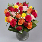 Assorted roses bouquet in a glass vase