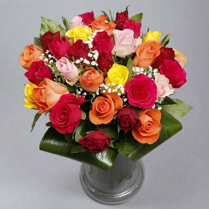 Assorted roses bouquet in a glass vase