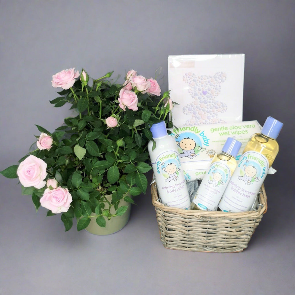 Gift hamper for a new-born baby boy with flowers
