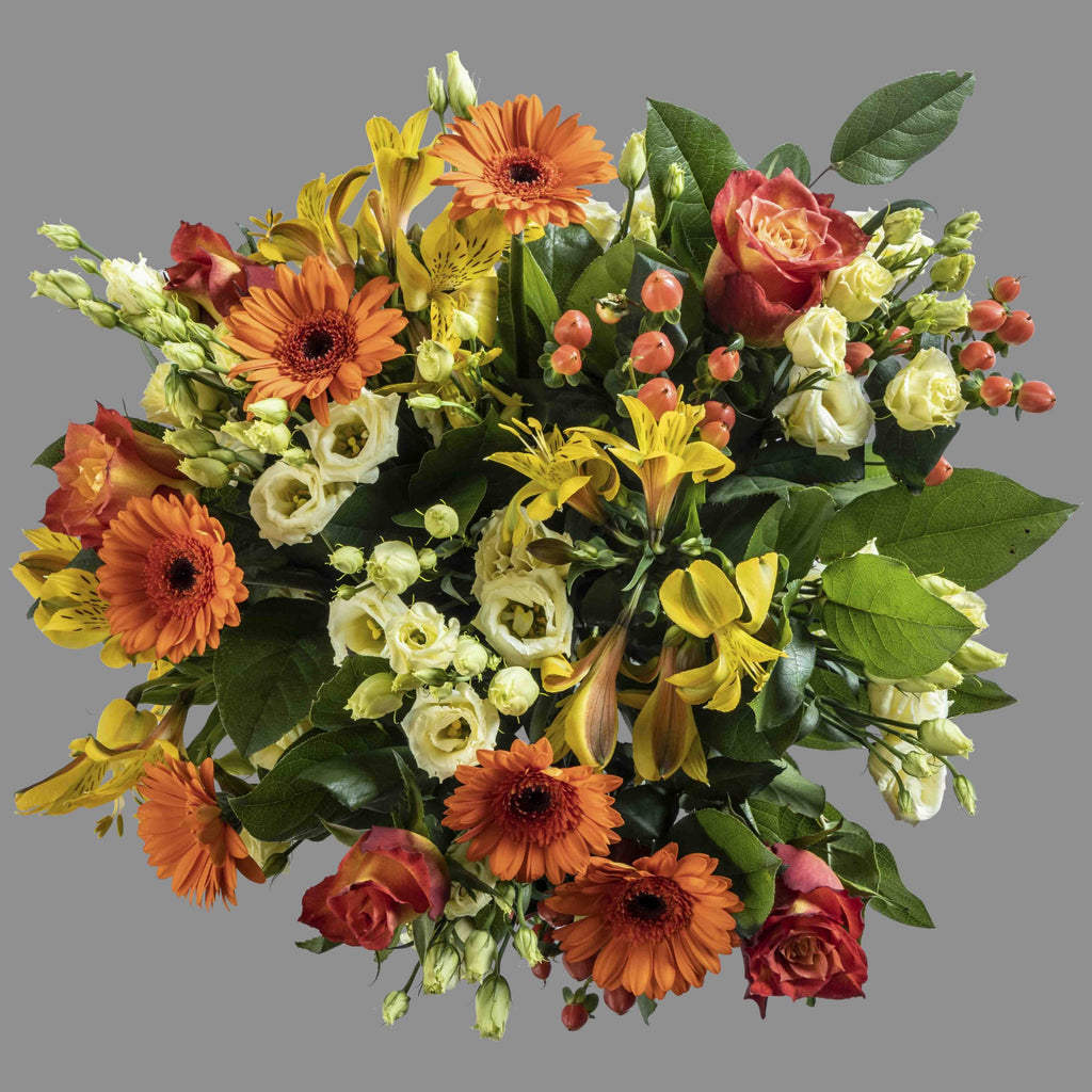 Top down view of Hot Stuff flower bouquet in a glass vase