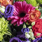 Close up view of Rainbows flower bouquet in a glass vase