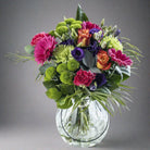 Rainbows flower bouquet in a glass vase