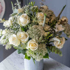 Lifestyle view of Sea spray flower bouquet in a glass vase