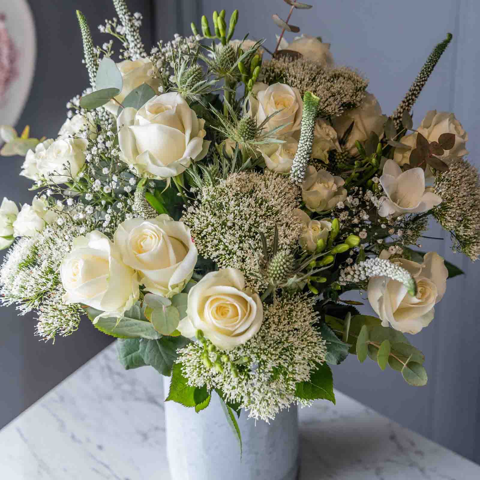 Lifestyle view of Sea spray flower bouquet in a glass vase